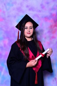 Low angle view of smiling young woman