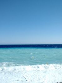 Scenic view of sea against clear blue sky