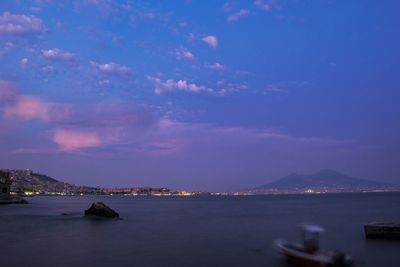 Scenic view of sea against sky at dusk