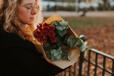 Woman holding flower bouquet