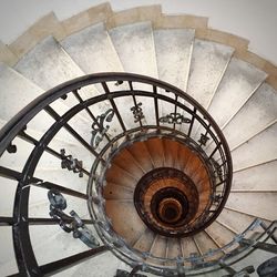 Directly below view of spiral staircase in building