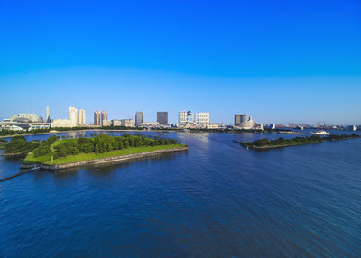 View of the bay of odaiba with daiba park, mall and hotels.