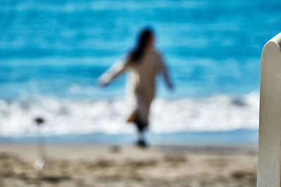 Rear view of man on beach