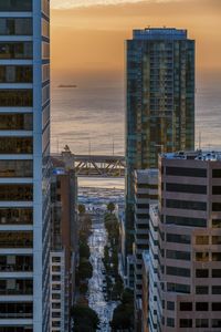 Panoramic view of city against sky during sunset