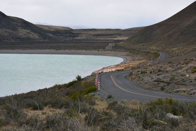 High angle view of road amidst mountains against sky