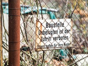 Information sign on chainlink fence