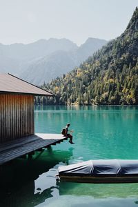 Scenic view of lake and mountains against sky