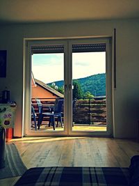 Buildings seen through window of house