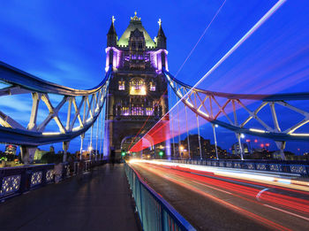 Light trails on suspension bridge at night