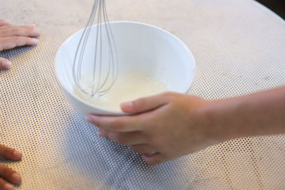 High angle view of woman preparing food in glass