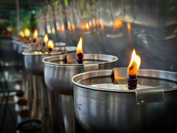 Close-up of lit tea light candles