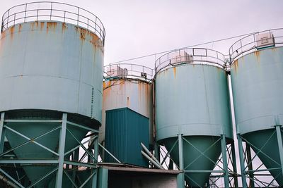 Metallic structure in factory against clear sky