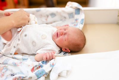 High angle view of cute baby sleeping