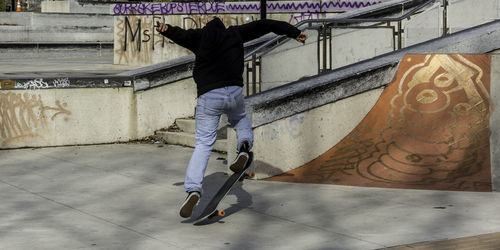 Rear view of man on skateboard