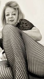 Portrait of a smiling young woman sitting outdoors