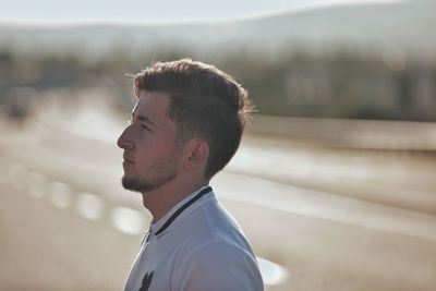 Portrait of young man looking away