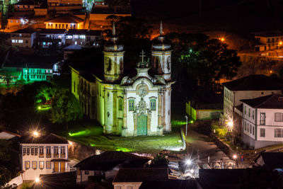 Illuminated buildings in city at night