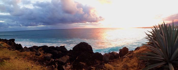 Scenic view of sea against sky at sunset