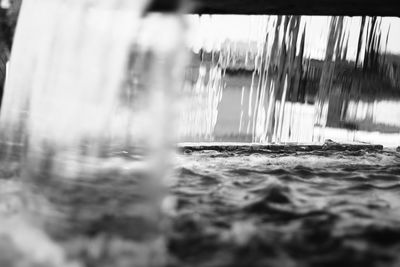 Close-up of water flowing over sea