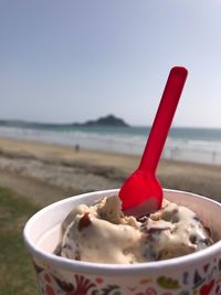 Close-up of ice cream on beach