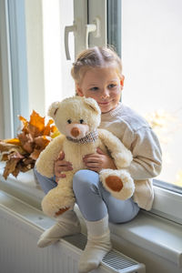 Portrait of cute boy with teddy bear