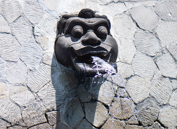 Close-up of fountain against wall