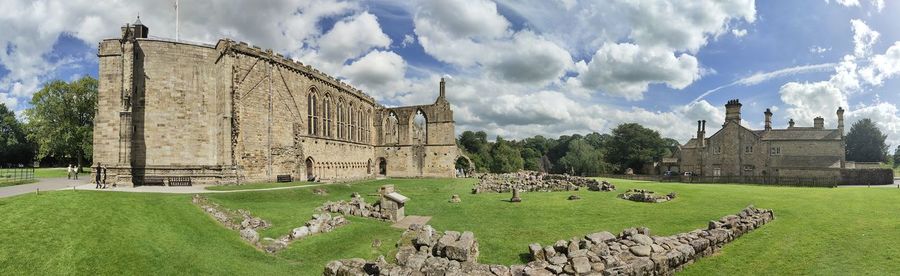 Panoramic view of bolton abbey on field