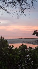 Scenic view of sea against sky at sunset