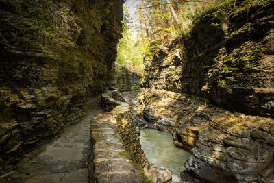 View of river flowing through rocks