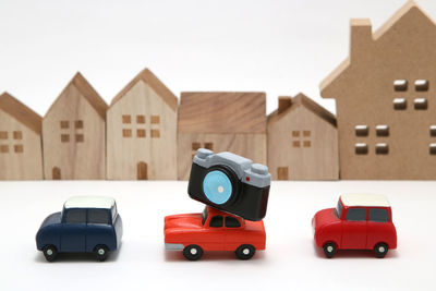 Close-up of toy car against building