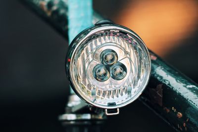 Close-up of headlight on motorcycle