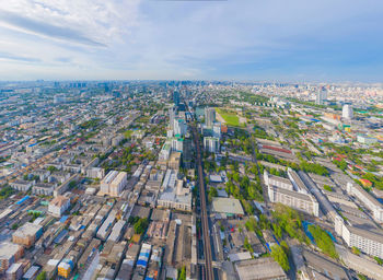 High angle view of buildings in city against sky