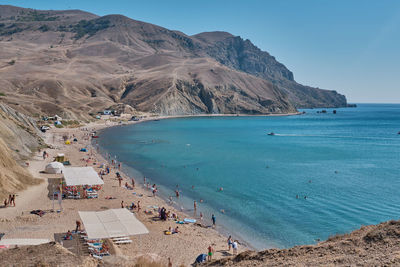 High angle view of people on beach against sky