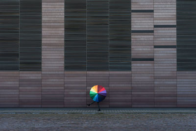 Woman behind umbrella