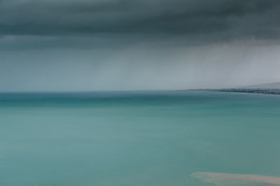 Scenic view of turquoise sea against sky