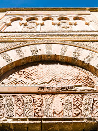 Close-up of ornate design on building wall