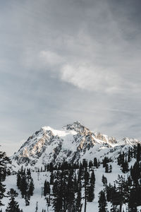 Snow covered mountains against sky