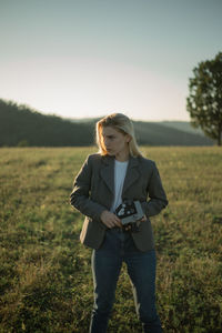 Full length of woman standing on field