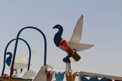 Birds against clear sky