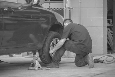 Man repairing car