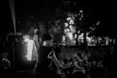 People enjoying music concert at night