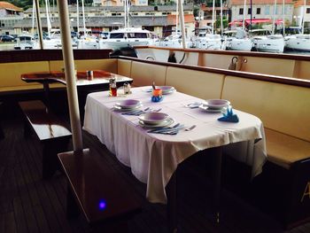 Empty chairs and tables in restaurant