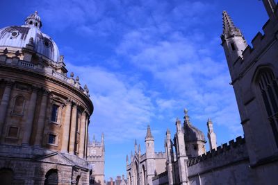 Low angle view of church against cloudy sky