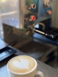 Close-up of coffee cup on table