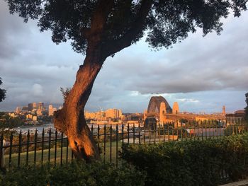 View of sydney harbour bridge against cloudy sky 