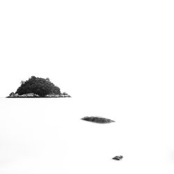 Scenic view of rocks against clear sky