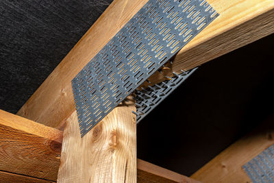Barbed tile connecting the roof structure covered with a membrane on a single-family house. 