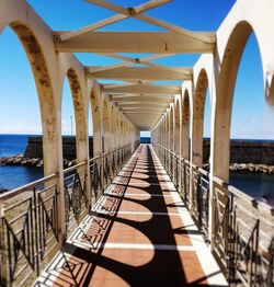 Bridge over sea against sky