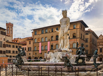 Statue against building