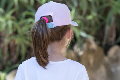 Rear view of girl wearing cap